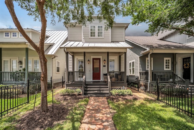 8720 Kempwood Dr, Houston, TX 77080 - view of front of property featuring covered porch, a standing seam roof, and a metal roof