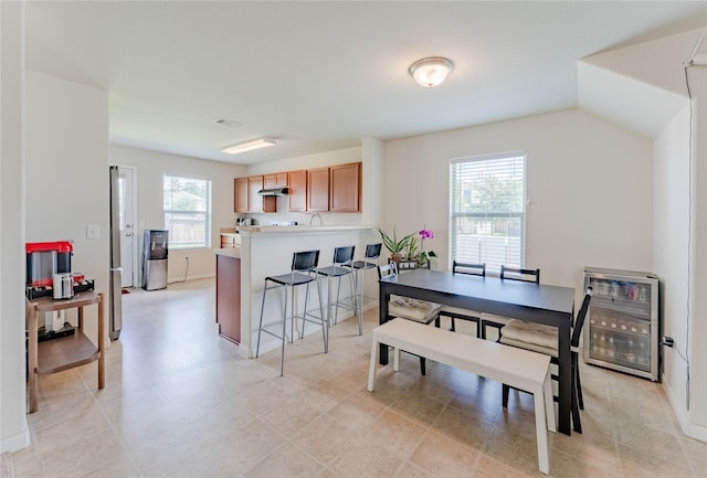 9902 Waldens Pond Ct, Houston, TX 77044 - dining area featuring wine cooler and baseboards