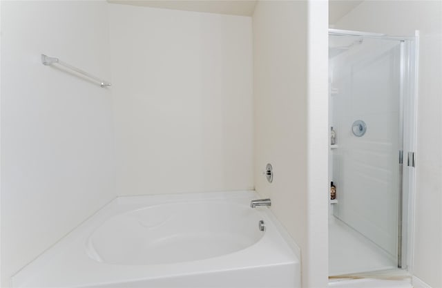 9902 Waldens Pond Ct, Houston, TX 77044 - full bath featuring a stall shower and a bath
