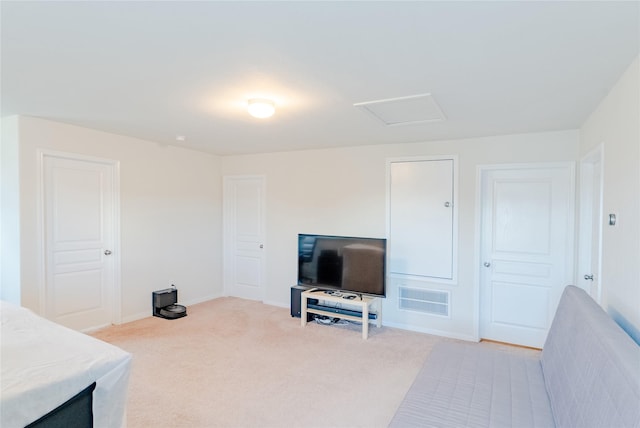 9902 Waldens Pond Ct, Houston, TX 77044 - carpeted living room featuring baseboards and attic access