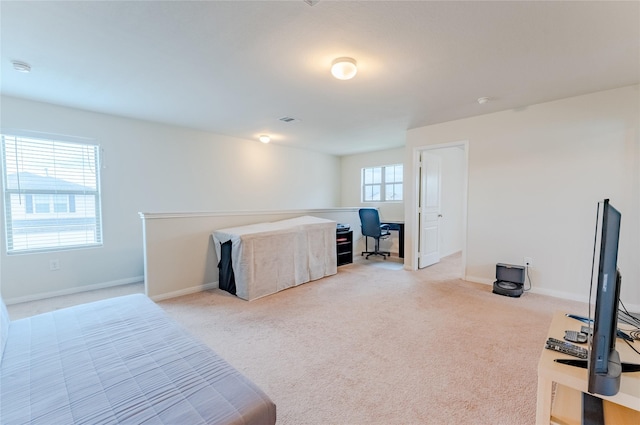 9902 Waldens Pond Ct, Houston, TX 77044 - bedroom with light carpet and a desk