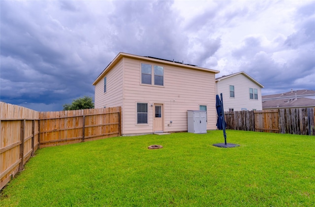 9902 Waldens Pond Ct, Houston, TX 77044 - back of house with a fenced backyard