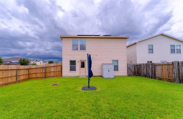 9902 Waldens Pond Ct, Houston, TX 77044 - back of house with a fenced backyard