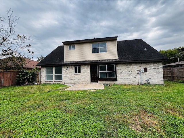 16246 Los Altos Dr, Houston, TX 77083 - back of house with a fenced backyard, a patio area, brick siding, and a shingled roof