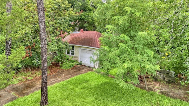 6907 Isla Rd, Brookside, TX 77581 - view of yard featuring driveway and a detached garage