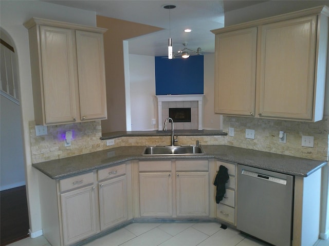 3307 Norma Ln, Pearland, TX 77584 - kitchen featuring stainless steel dishwasher, backsplash, dark countertops, and light tile patterned flooring