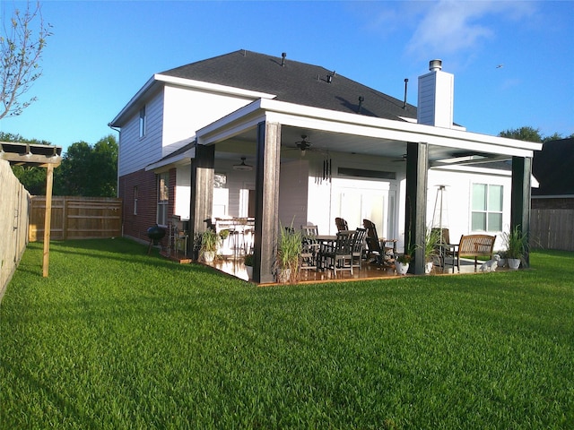 3307 Norma Ln, Pearland, TX 77584 - rear view of house with ceiling fan, a chimney, a fenced backyard, and a patio