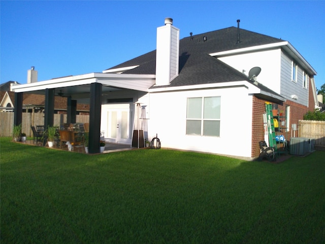 3307 Norma Ln, Pearland, TX 77584 - rear view of property with a chimney, a patio area, and roof with shingles