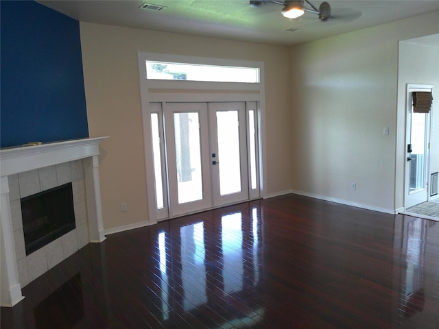 3307 Norma Ln, Pearland, TX 77584 - entryway featuring dark wood finished floors, a fireplace, and french doors