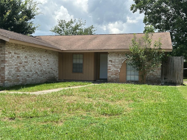 727 Doncrest St, Channelview, TX 77530 - view of front facade featuring a front lawn, brick siding, and a shingled roof