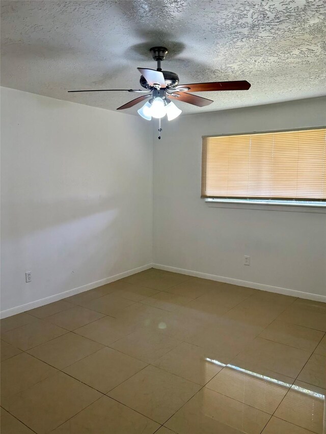 727 Doncrest St, Channelview, TX 77530 - spare room featuring a ceiling fan, a textured ceiling, and tile patterned flooring