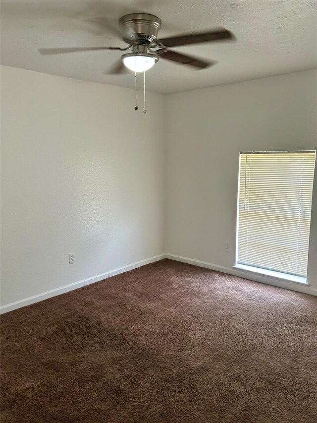 727 Doncrest St, Channelview, TX 77530 - empty room featuring ceiling fan and dark colored carpet
