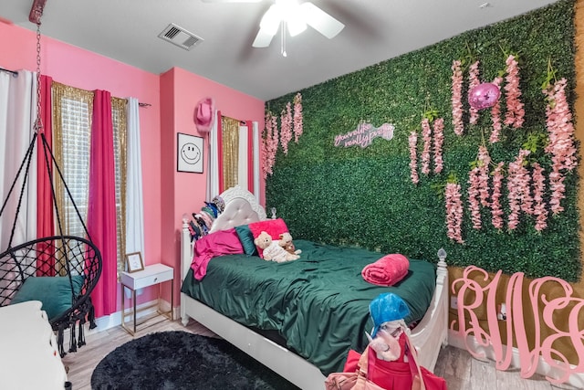 8315 Egret Bay Cir, Baytown, TX 77523 - bedroom with wood finished floors and a ceiling fan