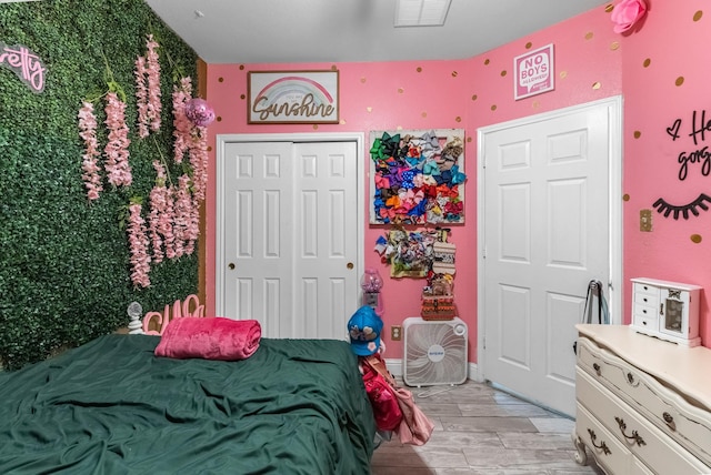 8315 Egret Bay Cir, Baytown, TX 77523 - bedroom with light wood-style floors and a closet