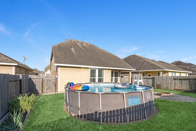 8315 Egret Bay Cir, Baytown, TX 77523 - rear view of property with a fenced backyard