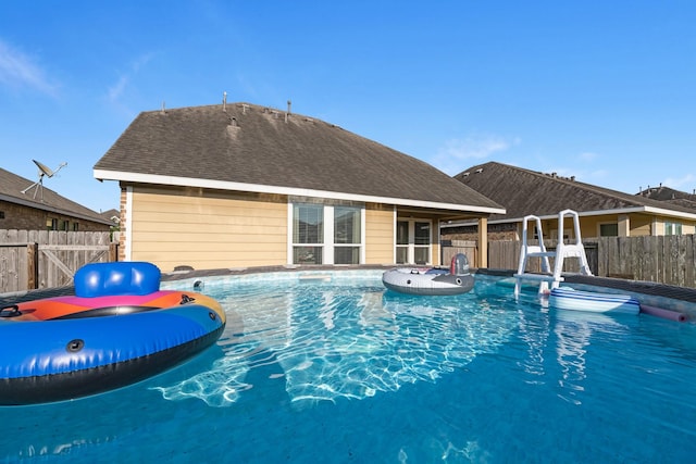 8315 Egret Bay Cir, Baytown, TX 77523 - view of swimming pool featuring a fenced backyard