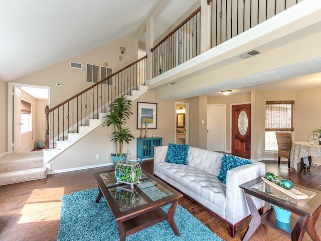9511 Tree Branch Dr, Houston, TX 77064 - living room with high vaulted ceiling, wood finished floors, and stairway