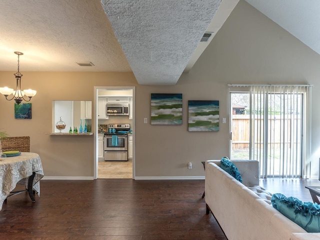9511 Tree Branch Dr, Houston, TX 77064 - living area with light wood-type flooring, a textured ceiling, and a chandelier
