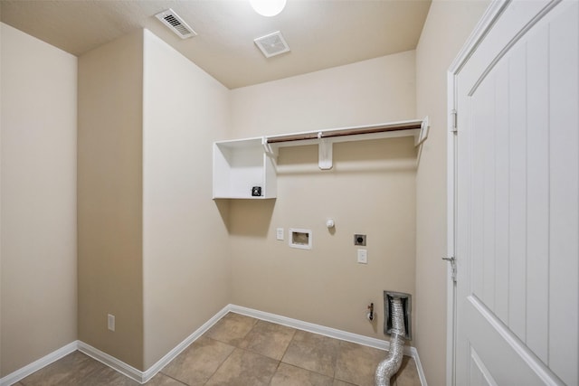1306 S Maple Dr, Katy, TX 77493 - laundry area with gas dryer hookup, hookup for an electric dryer, hookup for a washing machine, and light tile patterned flooring