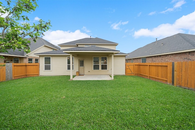 1306 S Maple Dr, Katy, TX 77493 - back of house featuring a patio, a fenced backyard, and roof with shingles