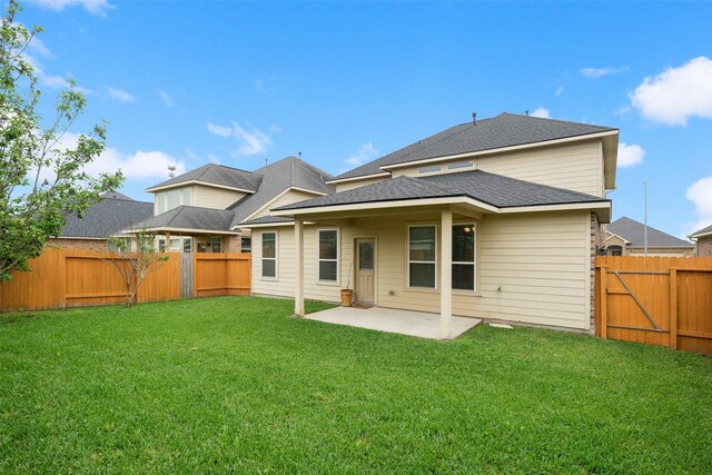 1306 S Maple Dr, Katy, TX 77493 - back of property featuring a patio, a fenced backyard, and roof with shingles