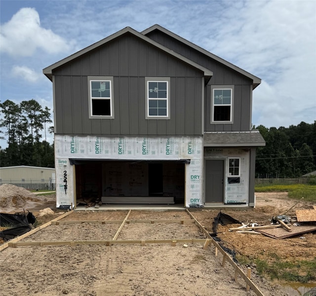 25981 Liberation Rd, Cleveland, TX 77328 - property under construction featuring board and batten siding and a garage