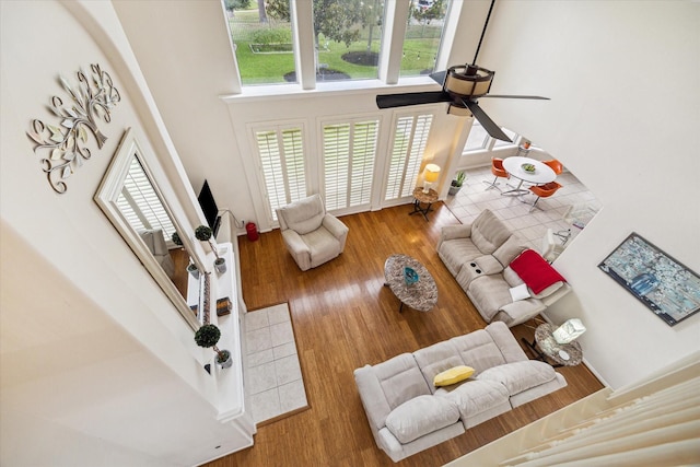 17326 Mesquite Brush Ln, Houston, TX 77095 - living area featuring ceiling fan, a high ceiling, and wood finished floors