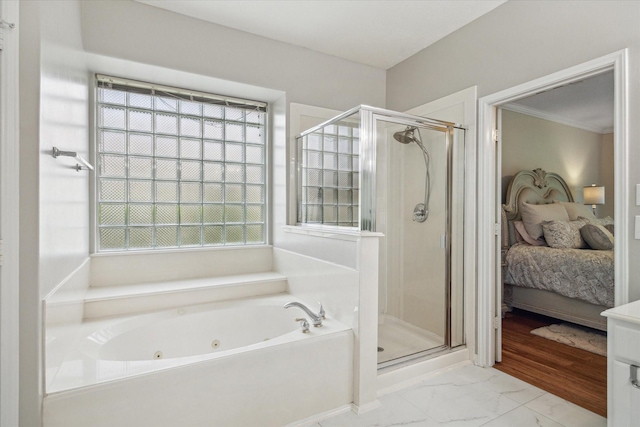17326 Mesquite Brush Ln, Houston, TX 77095 - bathroom featuring a shower stall, a jetted tub, ensuite bath, marble finish flooring, and plenty of natural light