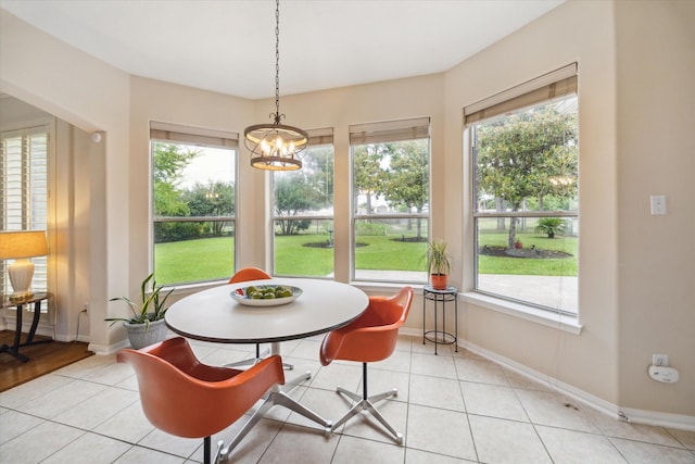 17326 Mesquite Brush Ln, Houston, TX 77095 - dining space with light tile patterned floors and a chandelier