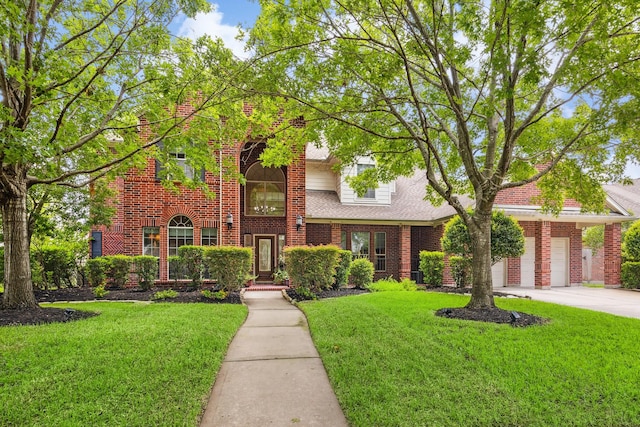 17326 Mesquite Brush Ln, Houston, TX 77095 - traditional-style house with driveway, brick siding, a garage, and a front yard