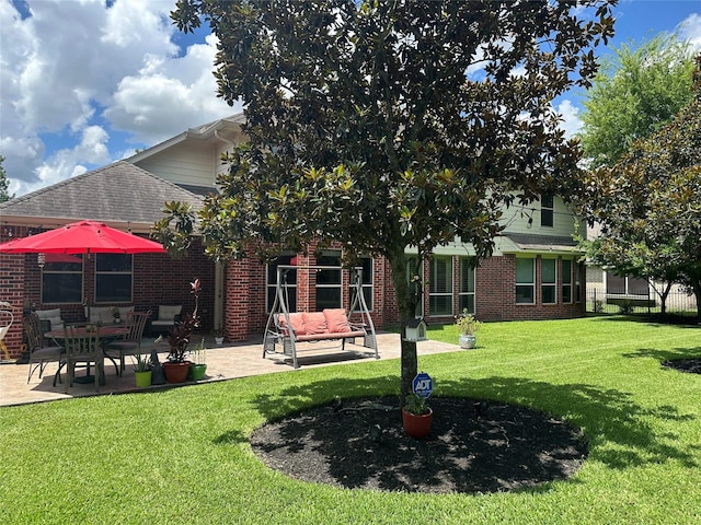 17326 Mesquite Brush Ln, Houston, TX 77095 - rear view of property with a patio area, brick siding, a lawn, and roof with shingles