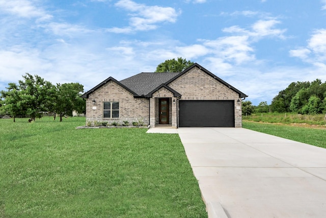 601 Lily St, Waller, TX 77484 - view of front of home featuring brick siding, a garage, a front lawn, concrete driveway, and roof with shingles