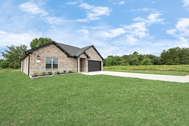601 Lily St, Waller, TX 77484 - view of front of house with brick siding, concrete driveway, an attached garage, and a front lawn