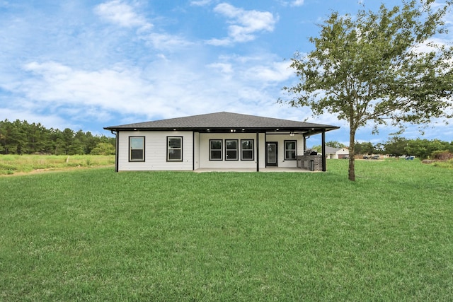 601 Lily St, Waller, TX 77484 - back of house with a patio and a yard