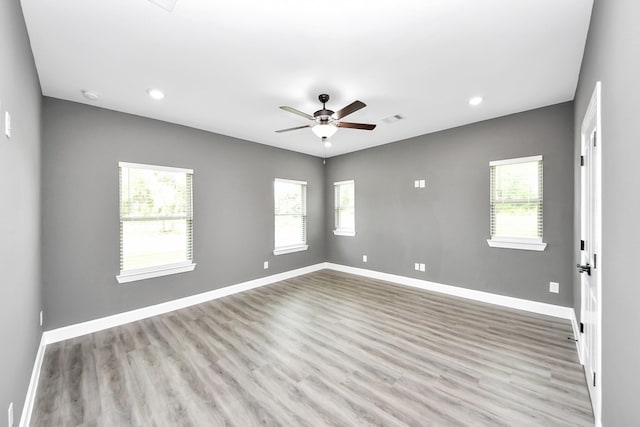 601 Lily St, Waller, TX 77484 - spare room with healthy amount of natural light, a ceiling fan, wood finished floors, recessed lighting, and a smoke detector