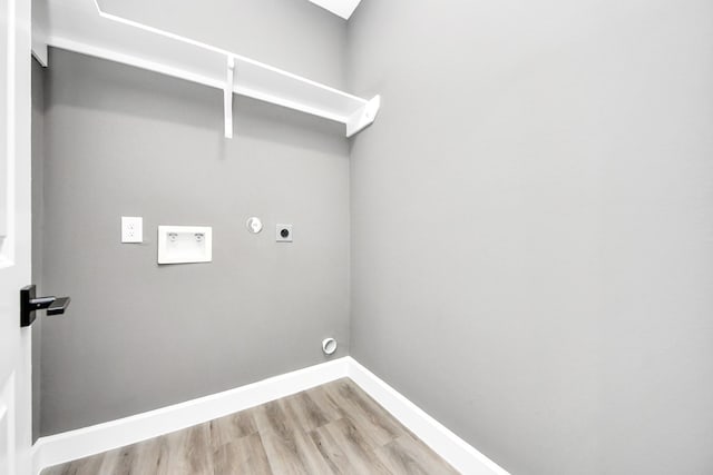 601 Lily St, Waller, TX 77484 - laundry area with hookup for an electric dryer, light wood-style floors, hookup for a gas dryer, and hookup for a washing machine