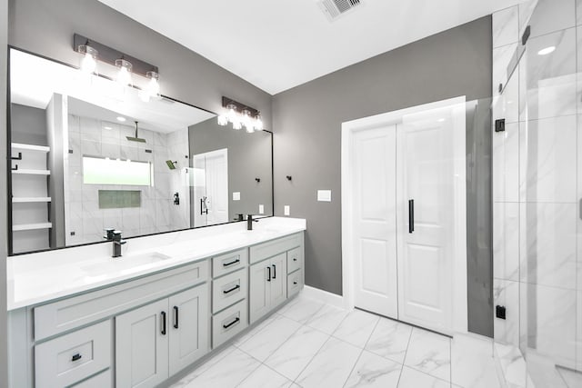601 Lily St, Waller, TX 77484 - bathroom with a marble finish shower, double vanity, and marble finish flooring