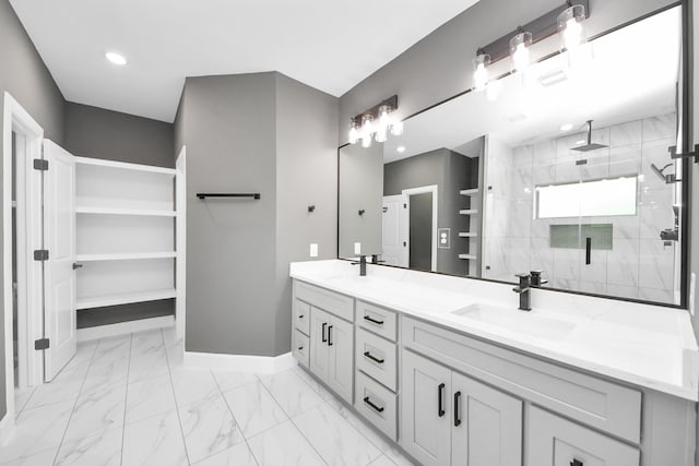 601 Lily St, Waller, TX 77484 - bathroom featuring double vanity, a shower stall, marble look tile flooring, and recessed lighting