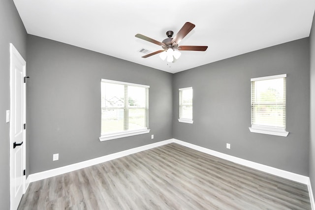 601 Lily St, Waller, TX 77484 - spare room with wood finished floors and a ceiling fan
