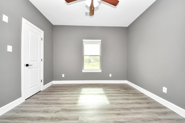 601 Lily St, Waller, TX 77484 - empty room with a ceiling fan and light wood-style floors