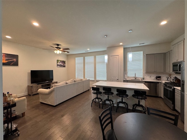 6031 Cypress St, Houston, TX 77074 - living room featuring dark wood finished floors, recessed lighting, and a ceiling fan