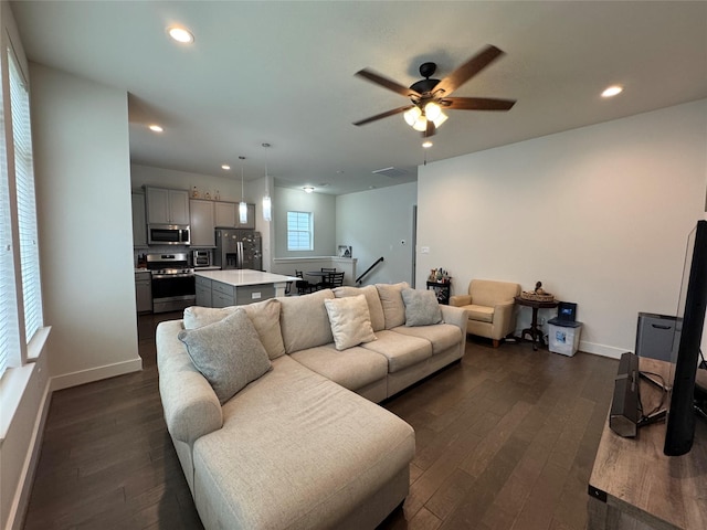 6031 Cypress St, Houston, TX 77074 - living area with dark wood finished floors, ceiling fan, and recessed lighting