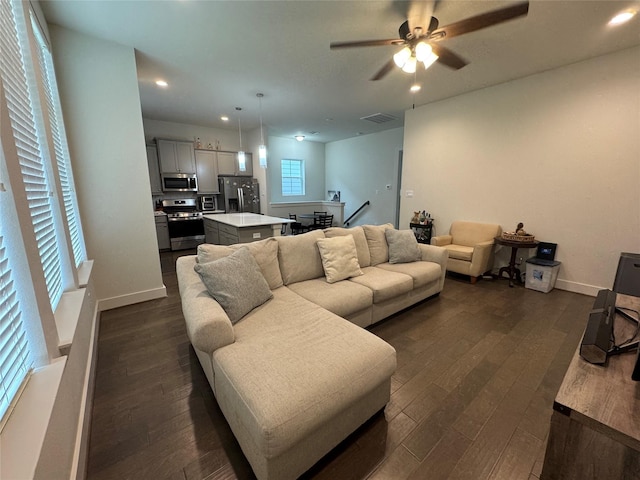 6031 Cypress St, Houston, TX 77074 - living area with dark wood-style floors, a ceiling fan, and recessed lighting