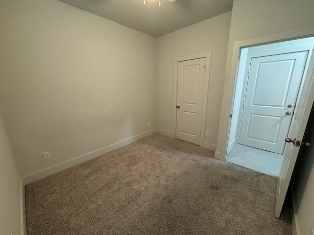 6031 Cypress St, Houston, TX 77074 - empty room featuring light carpet and baseboards