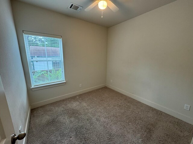 6031 Cypress St, Houston, TX 77074 - carpeted empty room featuring a ceiling fan and baseboards