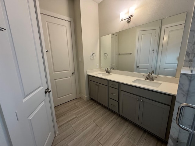 6031 Cypress St, Houston, TX 77074 - bathroom featuring double vanity and baseboards