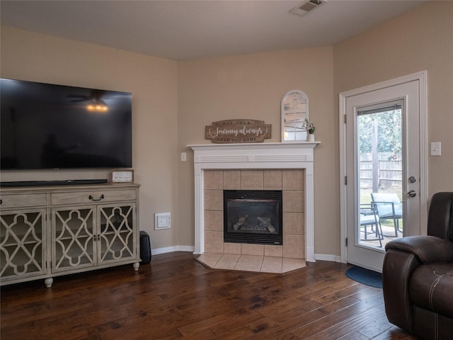 19327 Dickson Park Dr, Spring, TX 77373 - living room with dark wood-type flooring and a fireplace
