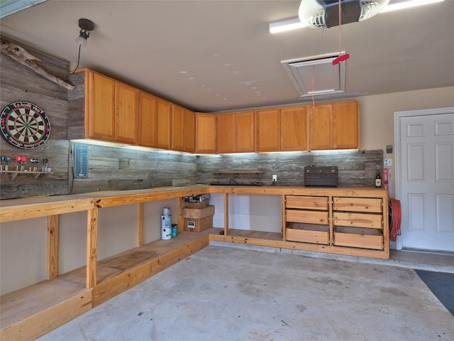 19327 Dickson Park Dr, Spring, TX 77373 - garage with a garage door opener and a workshop area