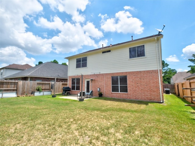 19327 Dickson Park Dr, Spring, TX 77373 - rear view of property featuring brick siding, a patio, and a fenced backyard
