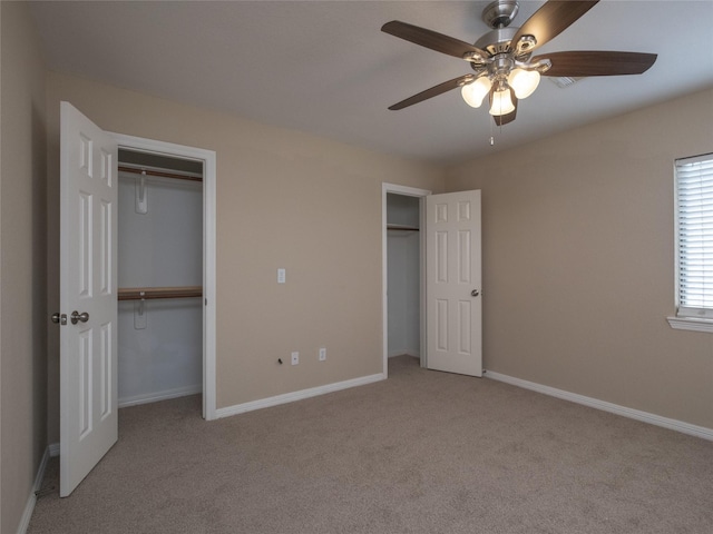 19327 Dickson Park Dr, Spring, TX 77373 - unfurnished bedroom with two closets, light colored carpet, and ceiling fan